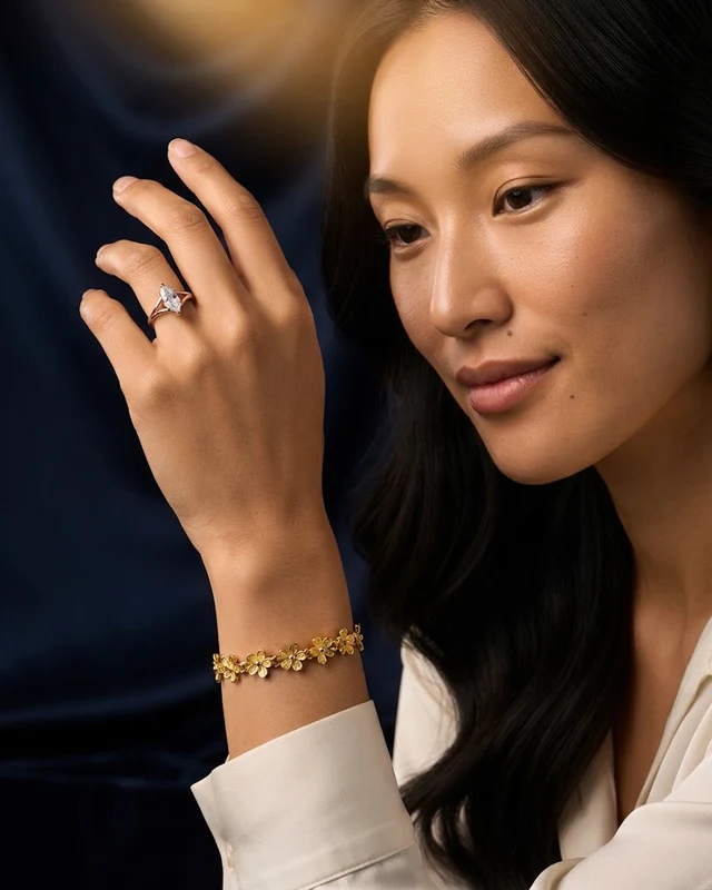 The Floral Link bracelet and the Marquise solitaire, worn on one hand